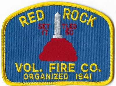 Red Rock Volunteer Fire Company (NY)
The red rock formation, known locally as the Aztec Sandstone, is quite hard.  The rocks put off red and orange colors.
